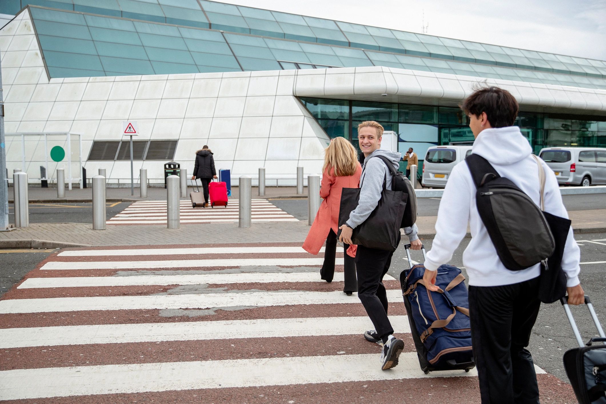 Travelers using airport taxi service