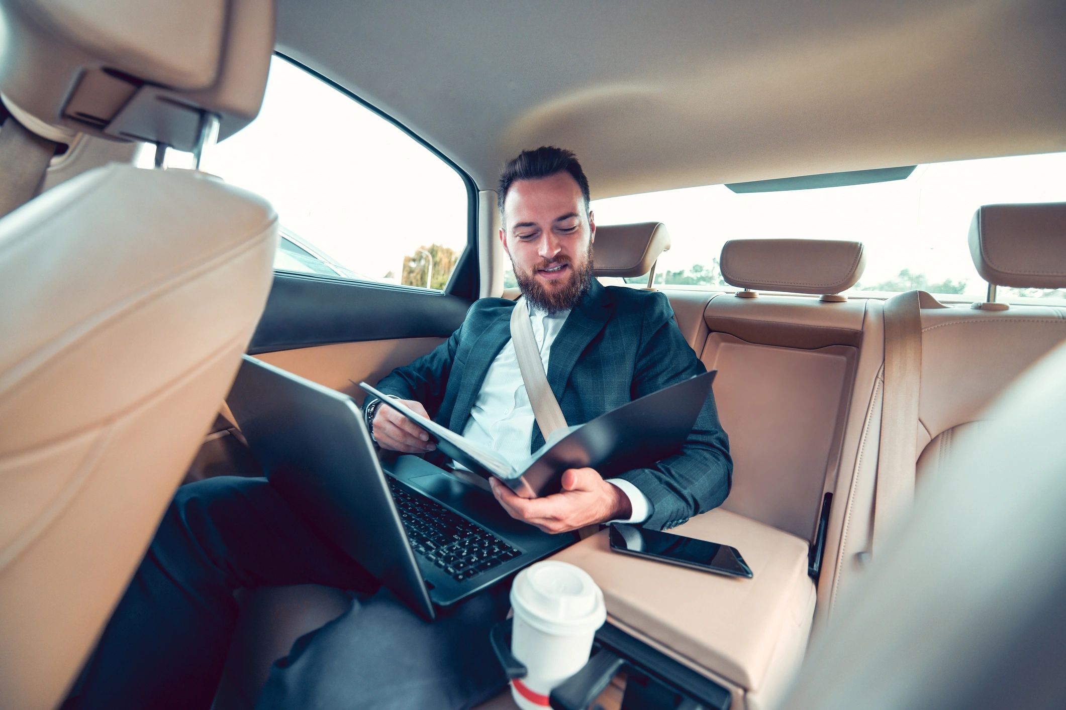 Executive traveler using airport transfer service