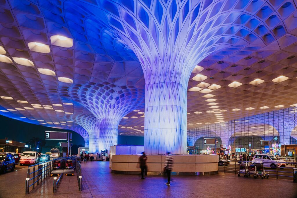 Mumbai Airport Terminal at Night With Futuristic Columns
